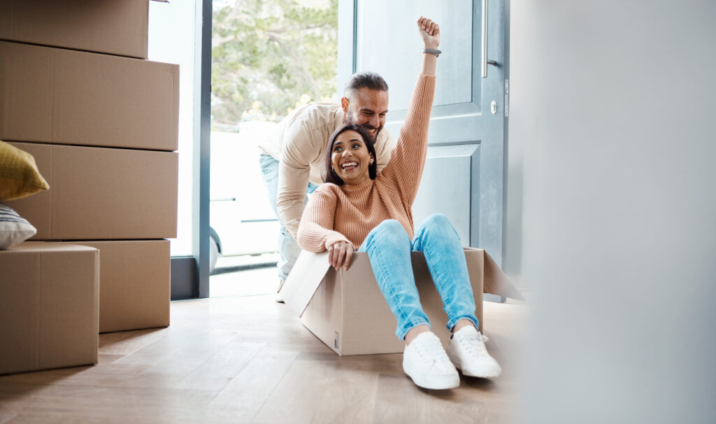 real estate boxes and happy couple celebrate for 2023 03 09 08 51 36 utc